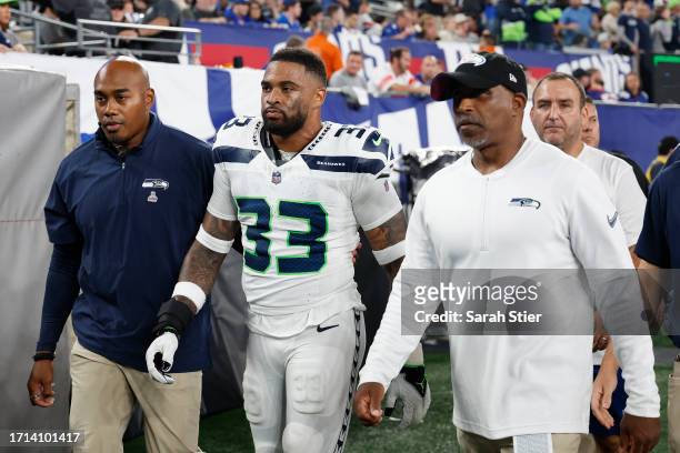 Jamal Adams of the Seattle Seahawks reacts as he walks to the locker room after suffering a concussion during the first quarter against the New York...