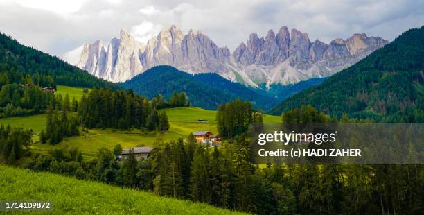 a summer view of the iconic santa maddalena or magdalena village in val di funes in dolomites, italy. - valley side stock pictures, royalty-free photos & images