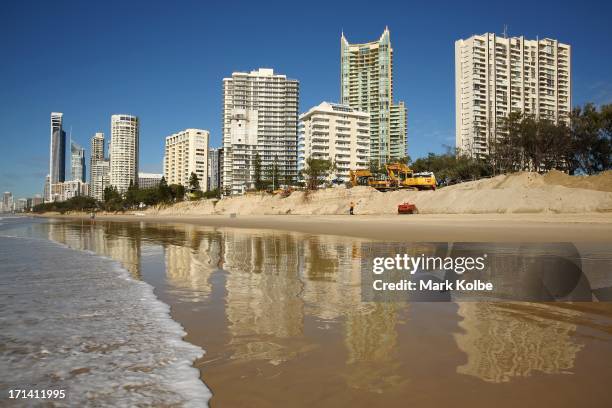 Heavy machinery is seen working on beach erosion at Main Beach Southport on June 24, 2013 on the Gold Coast, Australia. Large sea swells and king...