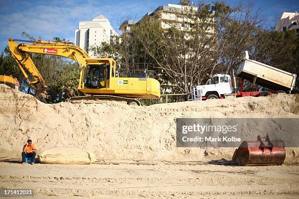 Heavy machinery is seen working on beach erosion at Main Beach Southport on June 24, 2013 on the Gold Coast, Australia. Large sea swells and king...