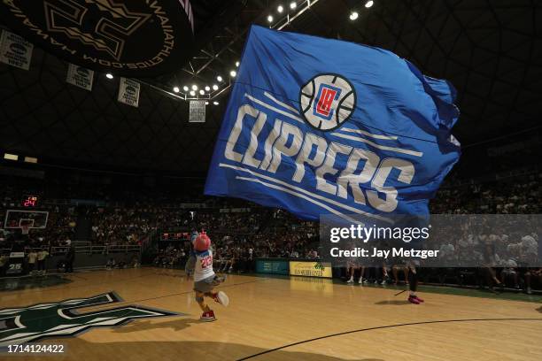 Mascot Chuck the Condor of the LA Clippers runs a flag before the game against the Utah Jazz on October 8, 2023 at the SimpliFi Arena at the Stan...