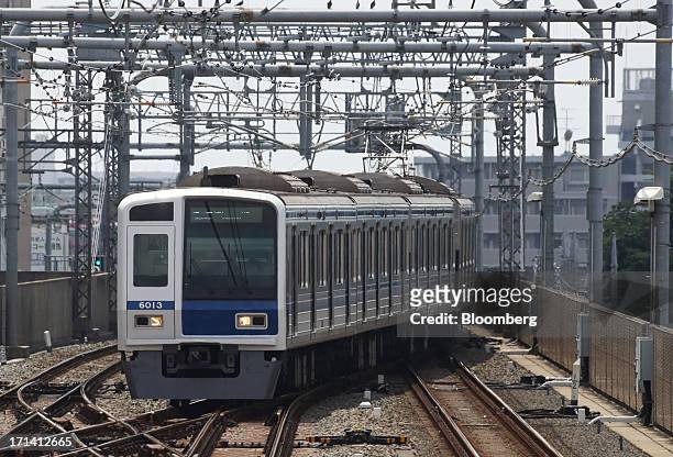 Seibu Railway Co. Train travels near Nerima Station in Tokyo, Japan, on Monday, June 24, 2013. Cerberus Capital Management LP is battling Seibu...