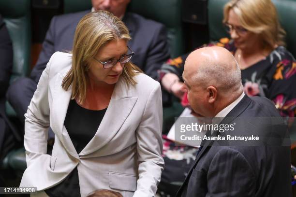 Premier of Victoria, Jacinta Allan speaks to Treasurer of Victoria Tim Pallas at Victorian Parliament house on October 03, 2023 in Melbourne,...