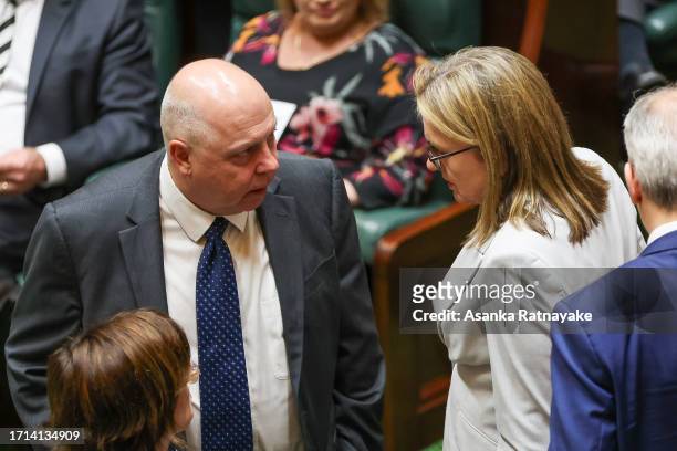 Premier of Victoria, Jacinta Allan speaks to Treasurer of Victoria Tim Pallas at Victorian Parliament house on October 03, 2023 in Melbourne,...