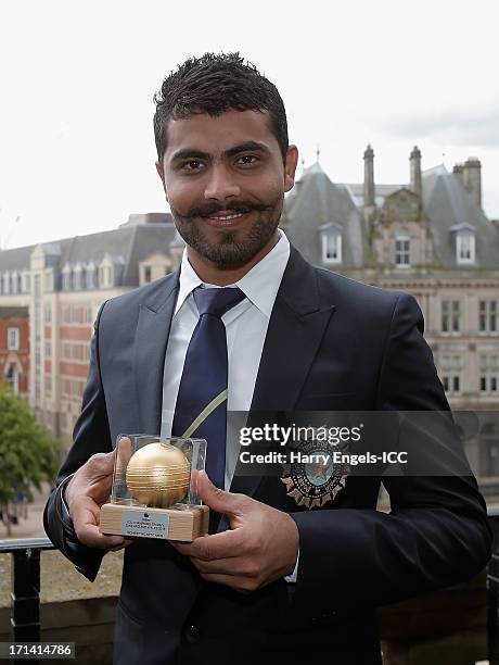 Man of the Match' Ravindra Jadeja poses with his trophy during a photocall for the winners of the ICC Champions Trophy on June 24, 2013 in...