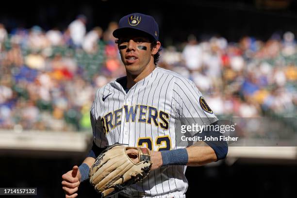Christian Yelich of the Milwaukee Brewers runs to the dugout between innings during the game against the Chicago Cubs at American Family Field on...
