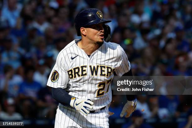 Willy Adames of the Milwaukee Brewers runs to first base after the swing during the game against the Chicago Cubs at American Family Field on October...