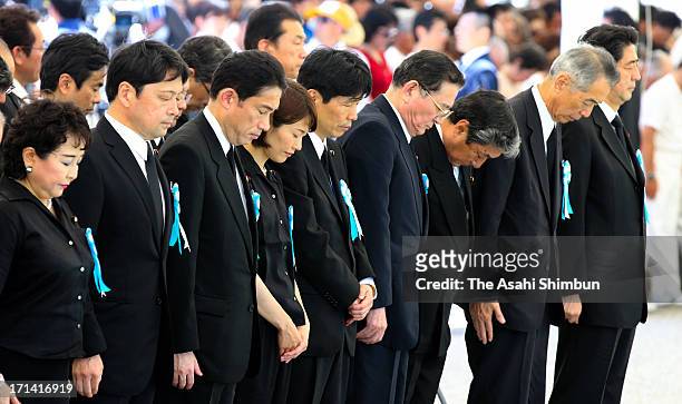 Japanese Prime Minister Shinzo Abe and cabinet members attend the peace memorial to mark the 68th anniversary of the termination of the Battle of...