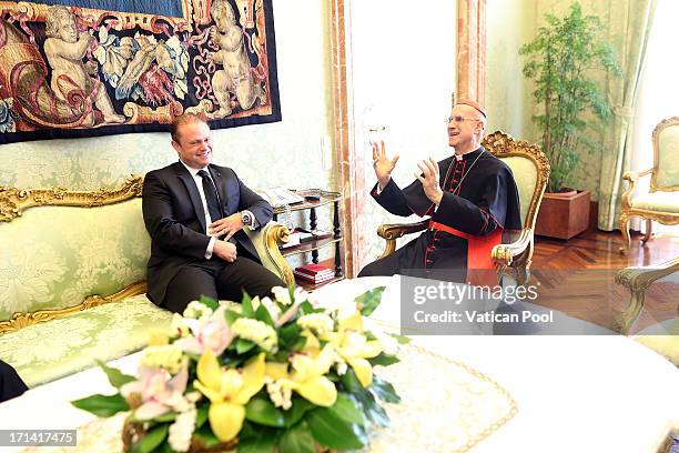 Vatican Secretary of State cardinal Tarcisio Bertone meets Maltese Prime Minister Joseph Muscat after an audience with Pope Francis on June 24, 2013...