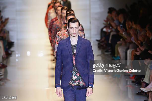 Models walk the runway at the Gucci show during Milan Menswear Fashion Week Spring Summer 2014 show on June 24, 2013 in Milan, Italy.