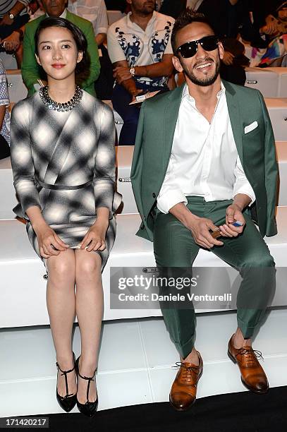 Emi Takei and Hidetoshi Nakata attend the Gucci show during Milan Menswear Fashion Week Spring Summer 2014 show on June 24, 2013 in Milan, Italy.