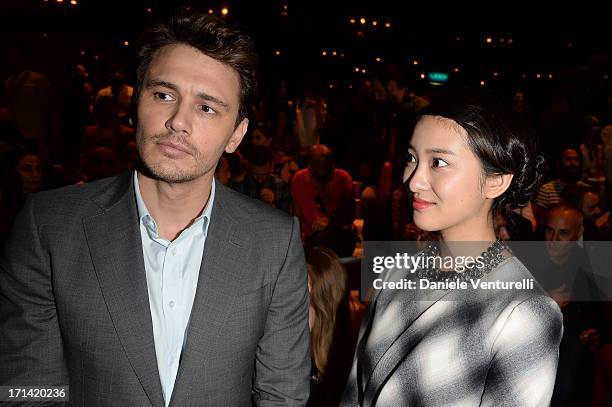 Emi Takei and James Franco attend the Gucci show during Milan Menswear Fashion Week Spring Summer 2014 show on June 24, 2013 in Milan, Italy.