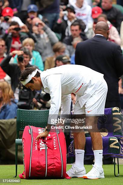 Roger Federer of Switzerland prepares before his gentlemen's singles first round match against Victor Hanescu of Romania on day one of the Wimbledon...