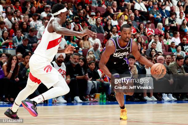 Harrison Barnes of the Sacramento Kings dribbles the ball during the game against the Toronto Raptors on October 8, 2023 at the Rogers Arena in...