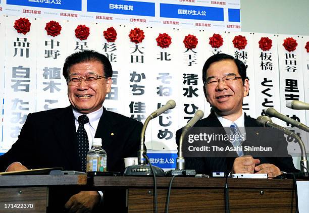 Japanese Communist Party Head of Secretariat Tadayoshi Ichida and Chairman Kazuo Shii smile as they gained 17 seats at their headquarters on June 23,...