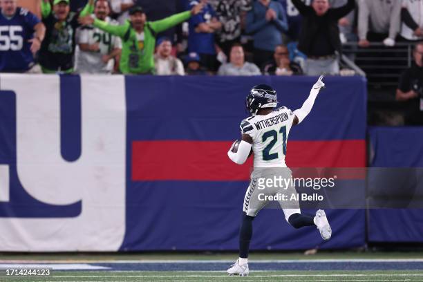 Devon Witherspoon of the Seattle Seahawks returns an interception 97-yards for a touchdown during the third quarter against the New York Giants at...