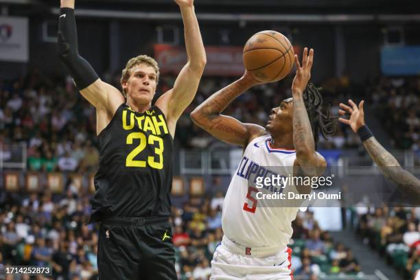 Bones Hyland of the Los Angeles Clippers shoots the ball against Lauri Markkanen of the Utah Jazz during the first half of the preseason game at...