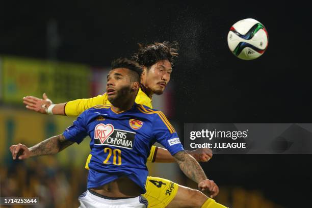 Ramon Lopes of Vegalta Sendai and Daisuke Suzuki of Kashiwa Reysol compete for the ball during the J.League J1 first stage match between Kashiwa...