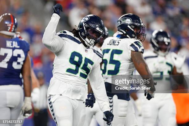 Myles Adams of the Seattle Seahawks celebrates after a sack during the fourth quarter against the New York Giants at MetLife Stadium on October 02,...
