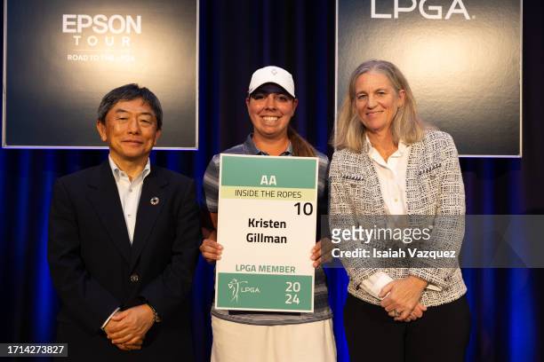 Eiichi Abe of Seiko Epson Corporation, Kristen Gillman of the United States, and LPGA Commissioner Mollie Marcoux pose with the LPGA Title Card...
