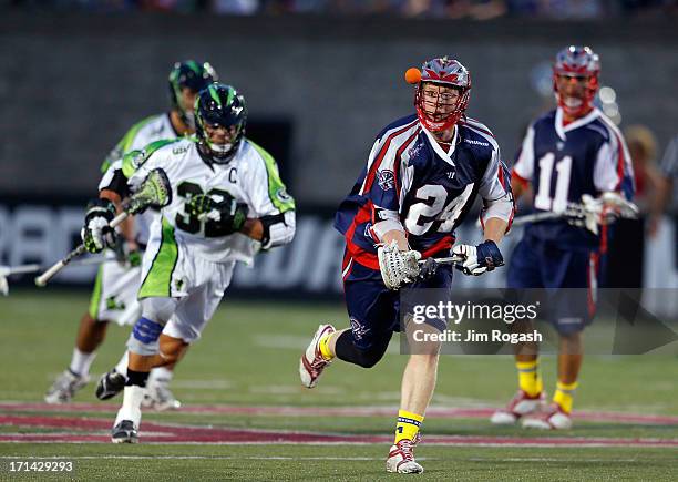 Chris Eck of the Boston Cannons gets by Greg Gurenlian of the New York Lizards at Harvard Stadium on June 21, 2013 in Boston, Massachusetts.