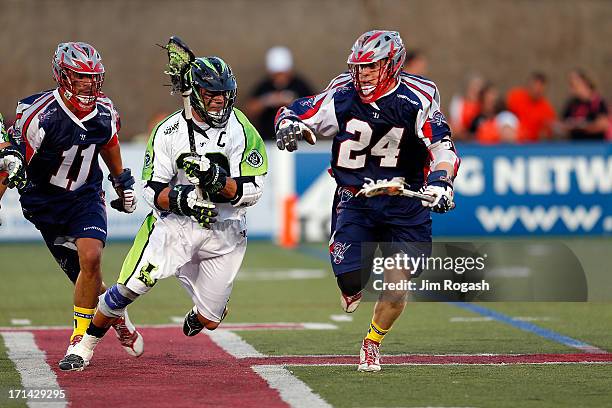 Chris Eck of the Boston Cannons gets by Greg Gurenlian of the New York Lizards at Harvard Stadium on June 21, 2013 in Boston, Massachusetts.