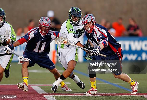 Chris Eck of the Boston Cannons gets by Greg Gurenlian of the New York Lizards at Harvard Stadium on June 21, 2013 in Boston, Massachusetts.