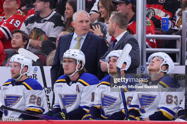 Head coach Craig Berube of the St. Louis Blues talks with assistant coach Steve Ott against the Chicago Blackhawks during the second period of a...