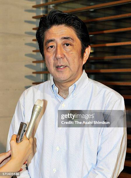 Japanese Prime Minister and Liberal Democratic Party president Shinzo Abe speaks to the media reporters at his official residence on June 23, 2013 in...