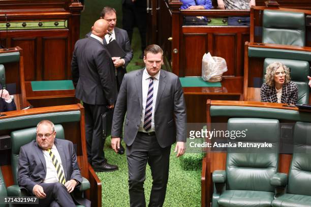 Shadow Minister for Tourism, Sport and Events Sam Groth walks onto the floor for Question Time at Victorian Parliament house on October 03, 2023 in...