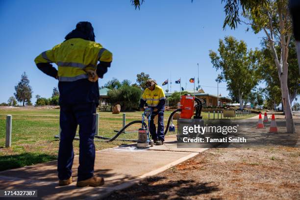 Local shire workers fix a pathway on October 03, 2023 in Yalgoo, Australia. A referendum for Australians to decide on an indigenous voice to...