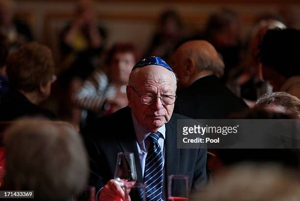 Bernhard Steinberg who arrived in the UK in 1938, sits as visitors gather during a reception with Prince Charles, Prince of Wales for Kindertransport...