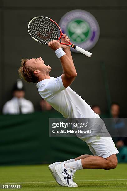 Steve Darcis of Belgium celebrates match point during his Gentlemen's Singles first round match against Rafael Nadal of Spain on day one of the...