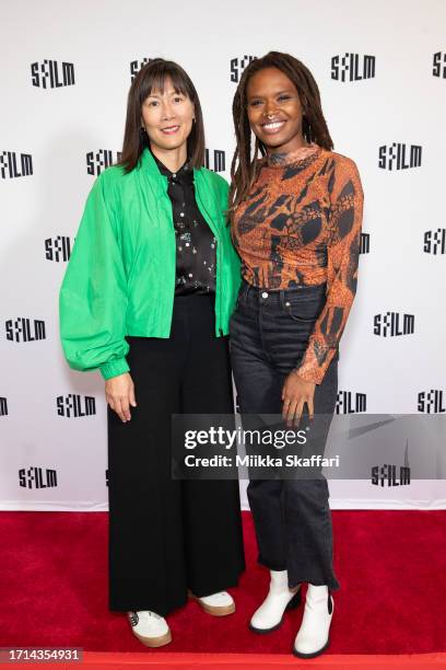 Executive director of SFFILM Anne Lai and director Raven Jackson arrive at the SFFILM screening of "All Dirt Roads Taste Of Salt" at Roxie Theater on...