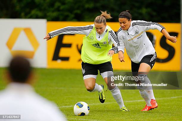 Josephine Henning fights for the ball with Dzsenifer Marozsan during the German women's national team training session at HVB Club Sportzentrum on...