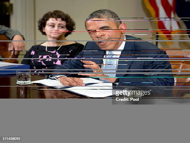 President Barack Obama makes a statement to the press prior to meeting with CEOs, business owners, and entrepreneurs in the Roosevelt Room of the...