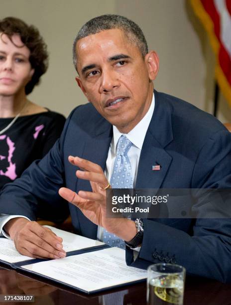 President Barack Obama makes a statement to the press prior to meeting with CEOs, business owners, and entrepreneurs in the Roosevelt Room of the...