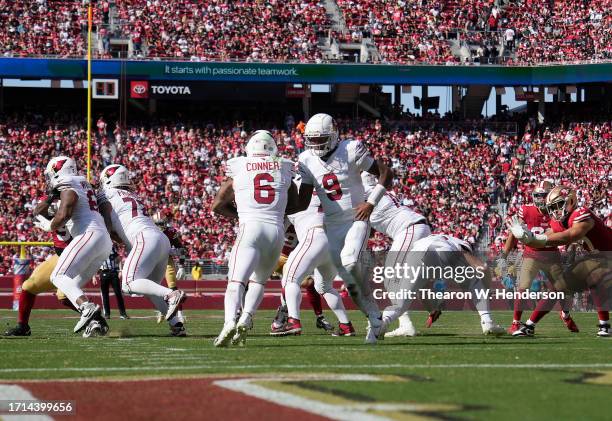 Joshua Dobbs of the Arizona Cardinals hands off to running back James Conner against the San Francisco 49ers during the third quarter of an NFL...