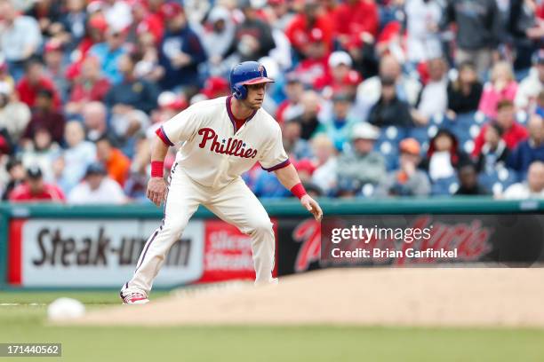 Laynce Nix of the Philadelphia Phillies takes a lead off of first during the game against the Cincinnati Reds at Citizens Bank Park on May 19, 2013...