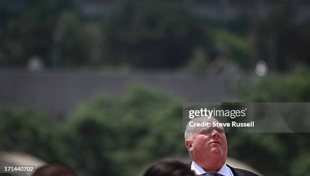 Toronto Mayor Rob Ford makes an appearance at the raising of the Rainbow flag to kick off Pride Week festivities on the Podium roof at City Hall.