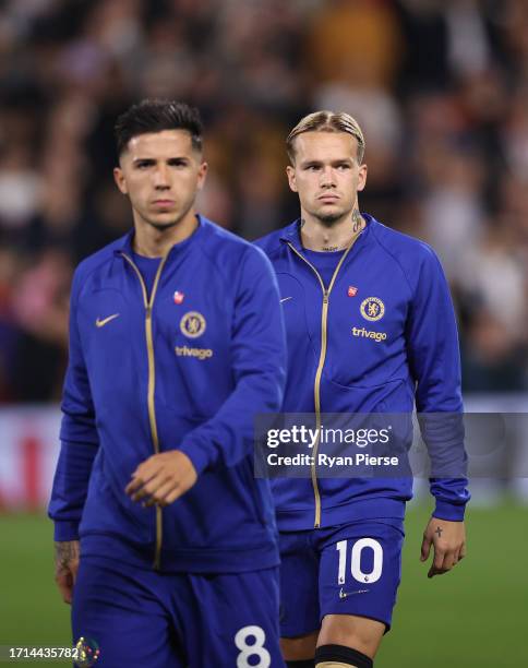 Enzo Fernandez of Chelsea and Mykhailo Mudryk of Chelsea walk out onto the pitch during the Premier League match between Fulham FC and Chelsea FC at...