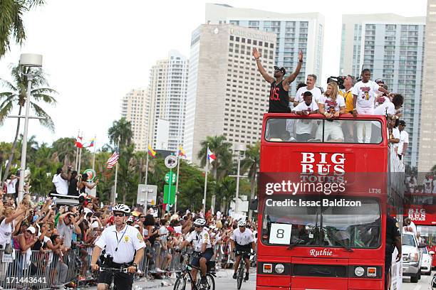 Dwyane Wade of the Miami Heat celebrates during the championship celebration parade through downtown on June 24, 2013 in Miami, Florida. The Miami...