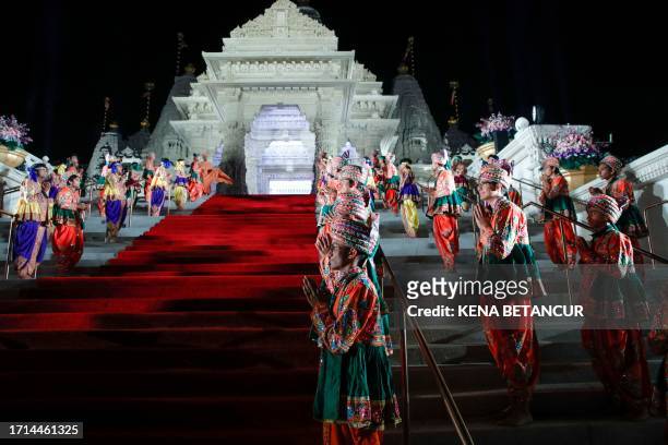 Dancers perform during the opening ceremony of the BAPS Swaminarayan Akshardham temple in Robbinsville, New Jersey on October 8, 2023. The Akshardham...