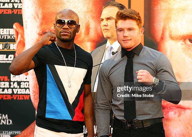 Floyd Mayweather and Canelo Alvarez pose for a photo during a news conference at the Pedestrian Walk in Times Square on June 24, 2013 in New York...