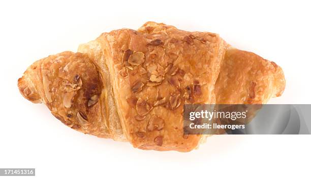 croissant with almond flakes - croissant white background stockfoto's en -beelden