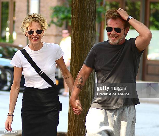 Meg Ryan and John Mellencamp are seen in Tribeca on June 24, 2013 in New York City.