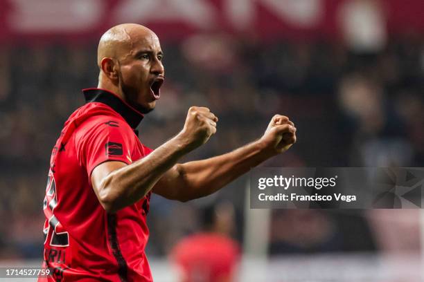 Carlos Gonzalez of Tijuana celebrates after scoring the team's second goal during the 12th round match between Tijuana and Atletico de San Luis as...