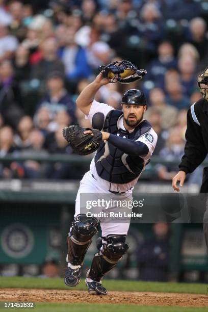 Catcher Kelly Shoppach of the Seattle Mariners chases a pop fly during the game against the Texas Rangers at Safeco Field on May 25, 2013 in Seattle,...