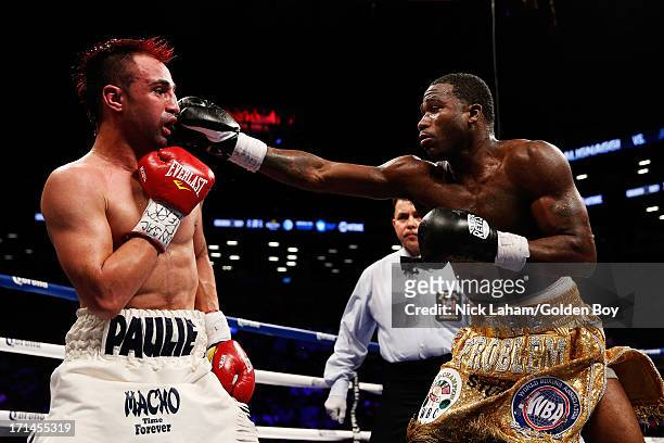 Adrien Broner punches Paulie Malignaggi during their WBA Welterweight Title bout at Barclays Center on June 22, 2013 in the Brooklyn borough of New...