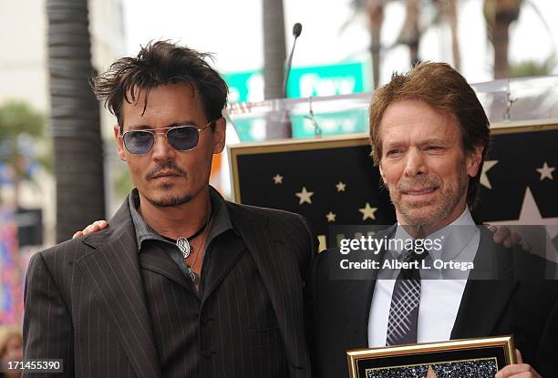 Actor Johnny Depp and producer Jerry Bruckheimer attend the Jerry Bruckheimer Star On The Hollywood Walk Of Fame on June 24, 2013 in Hollywood,...